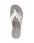 Top view of Breeze Flora thong sandal in white. Grey footbed has Clarks branding. 