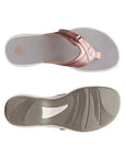 Top and bottom view of Breeze Sea sandal in rose gold. Clarks branding is visible on footbed and outsole. 