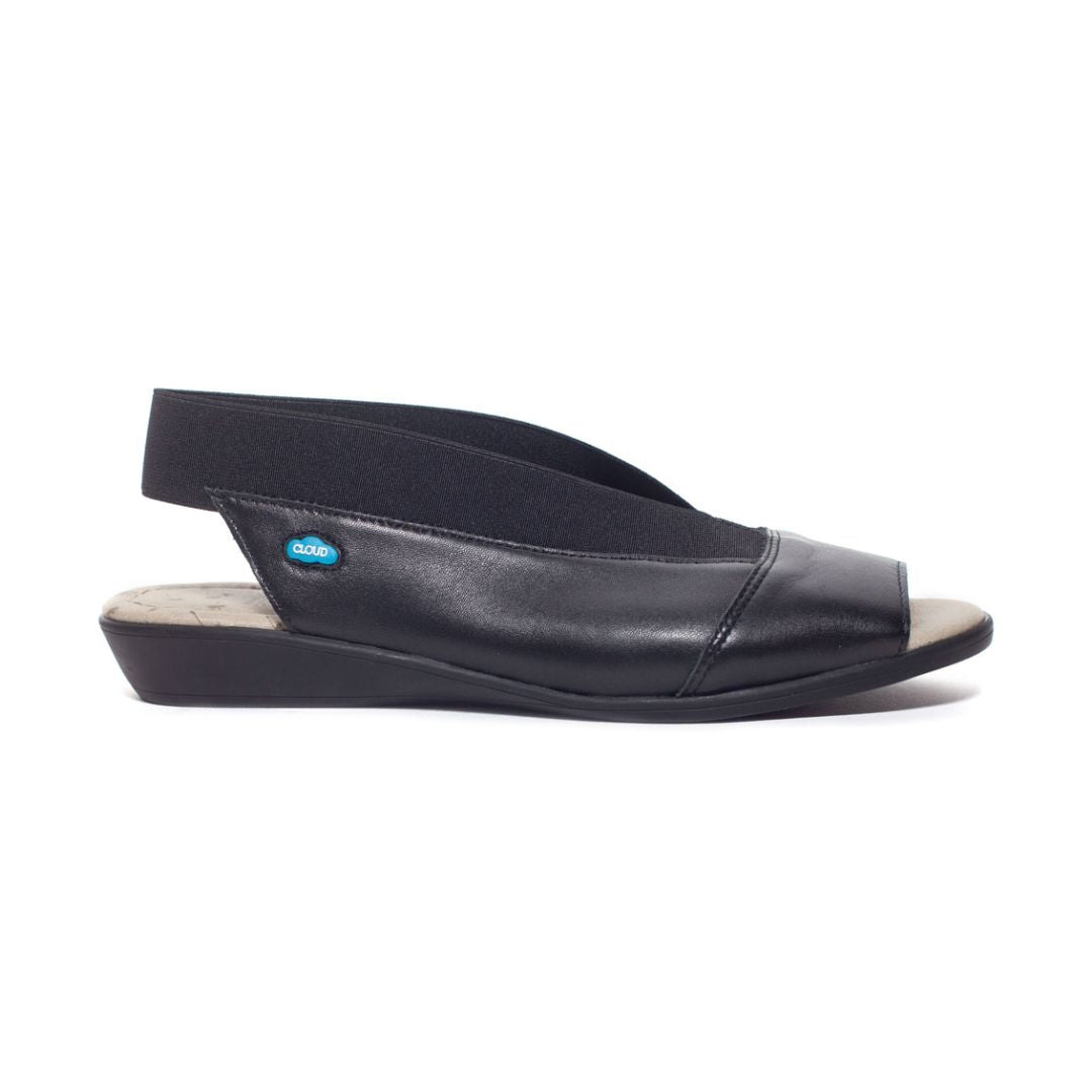 Caliber sandal in black. Black leather upper with elastic backstrap and peep toe cutout. Very low wedge outsole.