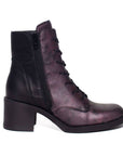 Profile view of Elise ankle boot with purple and black leather upper. 