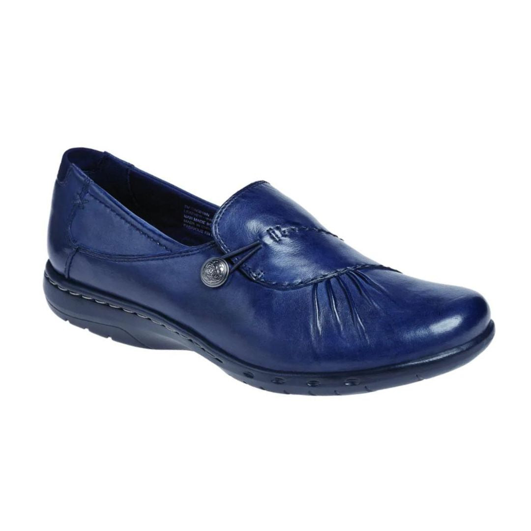 Paulette loafer in navy. A navy blue slip on with gathered leather detailing and a decorative silver button.