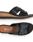 Top and side view of black leather slide wedge sandal with bow. Remonte logo printed on brown insole.