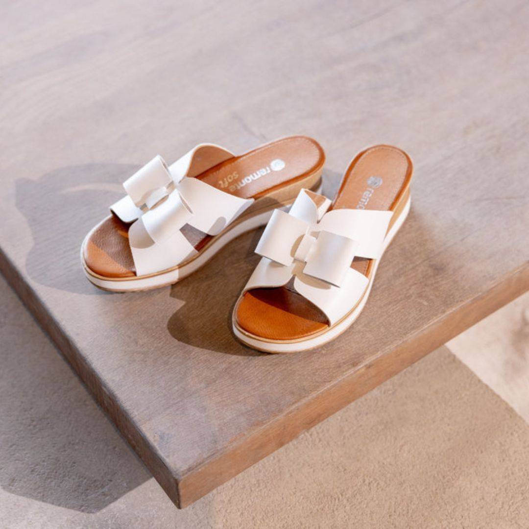 White leather slide wedge sandal with bow.