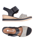 Black and white backstrap wedge sandal. Silver Remonte logo on brown footbed.