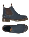 Navy blue Chelsea boot with dark brown elastic goring.