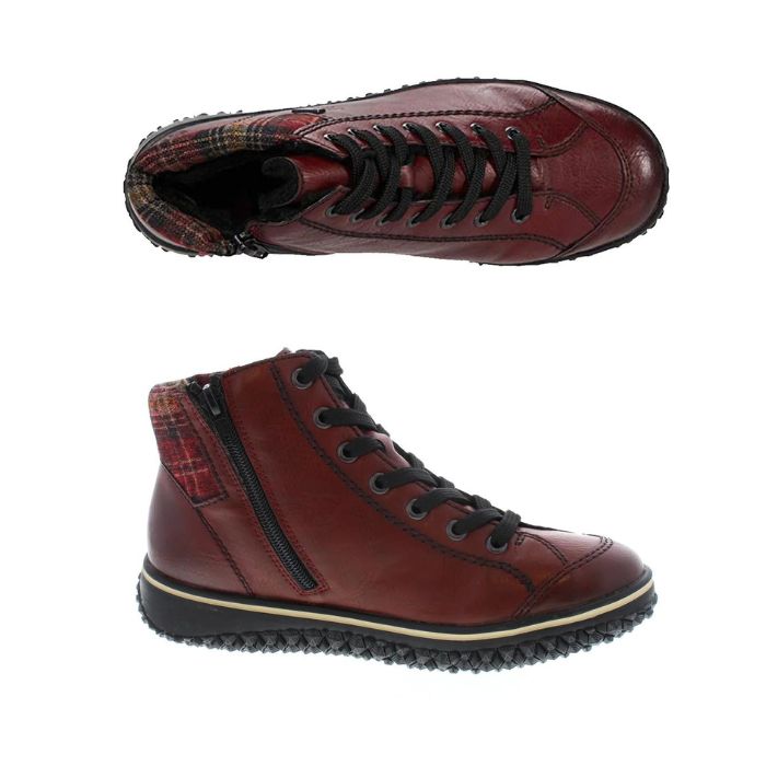 A pair of Rieker red leather sneaker boots with flat black laces, red plaid fabric heel cuff, circle logo on heel,  and black aggressive tread.