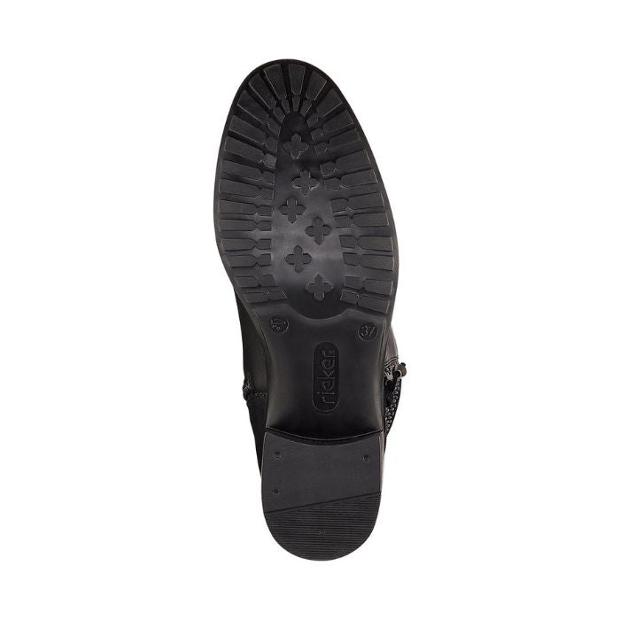 Black tread outsole of tall boot with Rieker logo stamped in middle.