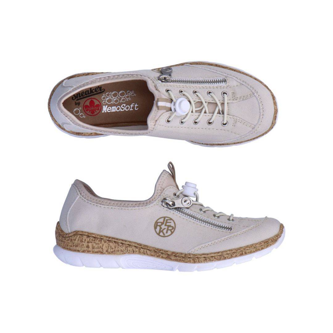 A pair of beige Rieker bungee cord slip-on sneakers with decorative side zipper, cork midsole and white outsole. 