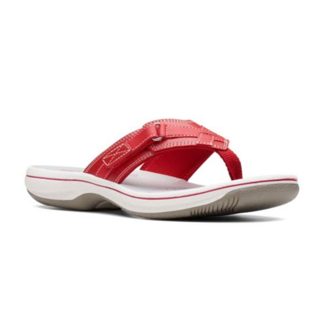 Breeze Sea thong sandal in red. Red upper featuring adjustable velcro strap and a fabric toe post. Footbed is grey, midsole is white, and outsole is taupe.