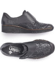 Top and side view of the black Slip-on casual 537C0-00 by Rieker has a cross foot velcro closure, sparkle detailing at the foot upper, slight wedge heel and brown trim line