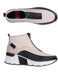 White top zipper sneaker with black accents and black and white wedge outsole.