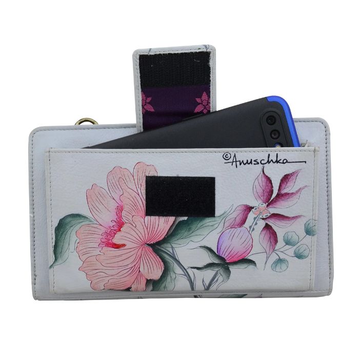 Rear exterior of grey leather with hand painted flowers on wallet featuring a slip pocket with phone peaking out and a velcro strap closure