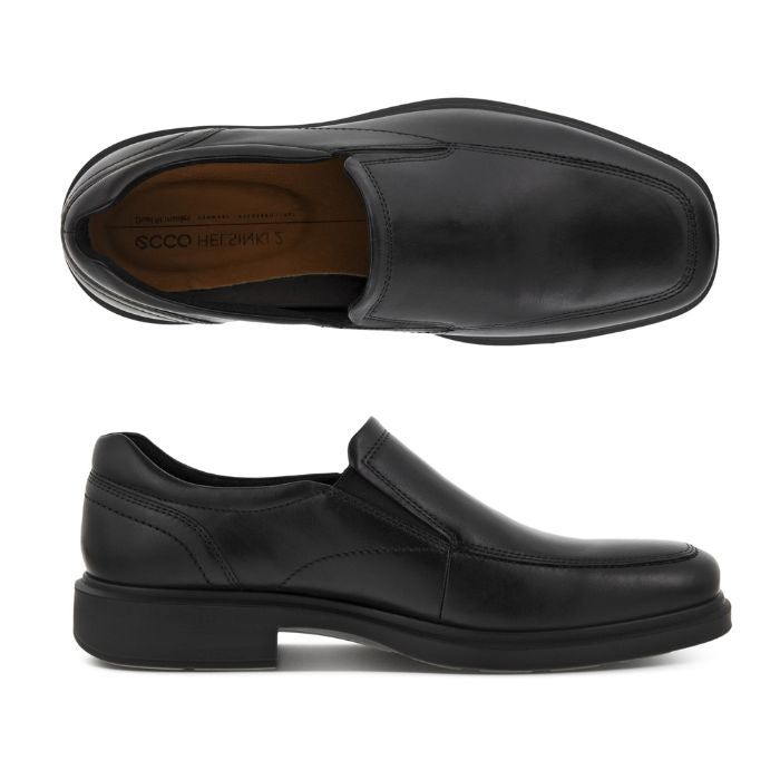 A pair of Ecco black leather slip on dress shoes with apron stitching and a square toe. Outsole is black. 