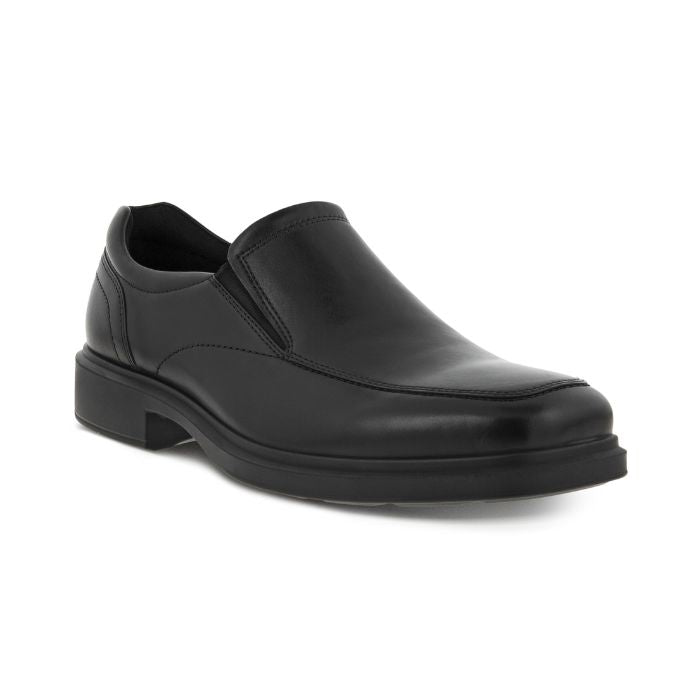 An Ecco black leather slip on dress shoe with apron stitching and a square toe. Outsole is black. 