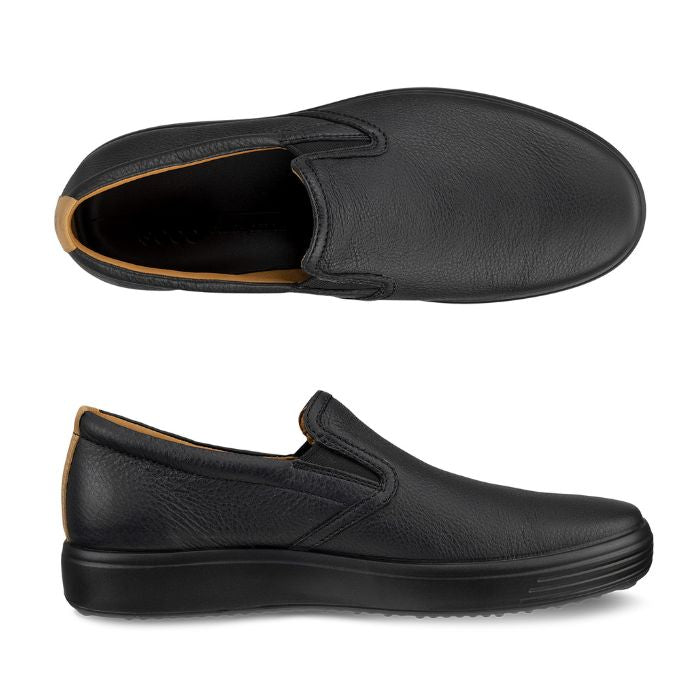 A pair of Ecco black leather slip-on with a black midsole and a tan brown lining. 