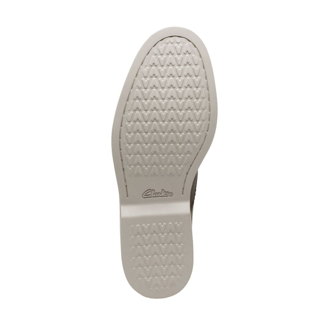 White rubber outsole with Clarks logo in center.