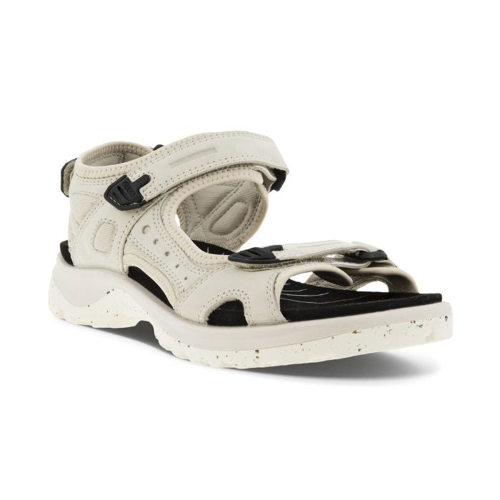 An Ecco Yucatan white nubuck sandal with black accents on heel, instep and toe velcro straps, a black footbed, and a white outsole. 