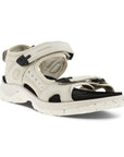 An Ecco Yucatan white nubuck sandal with black accents on heel, instep and toe velcro straps, a black footbed, and a white outsole. 